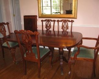 Double pedestal edge banded mahogany table with 2 armchairs, 3 side chairs and an extra armchair is a similar style