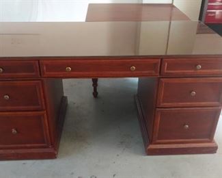Executive desk. This comes apart in 3 pieces for easy moving. It has a protective glass top