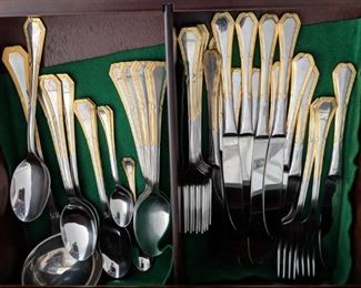 $40   Stainless flatware with gold trim