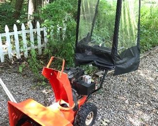 Snow blower with plastic walk  behind cab