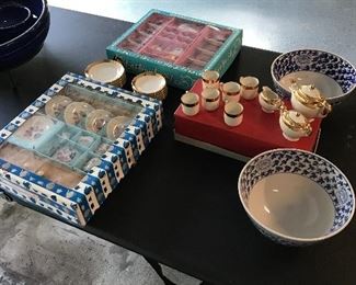 Three separate miniature tea sets