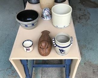 One drawer dropleaf table sporting ceramics