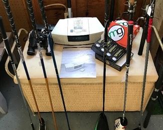 Assorted  Quality golf clubs,  golf balls, fishing poles,  binoculars and Bose wave radio