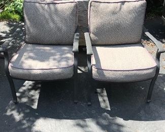Two of a set of six patio chairs with matching cushions and matching table