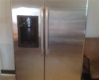 GE side by side refrigerator...21 cubic ft.  Stainless front and black sides...presale $225