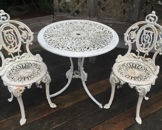 Metal outdoor furniture - chairs are cast iron, table is cast aluminum