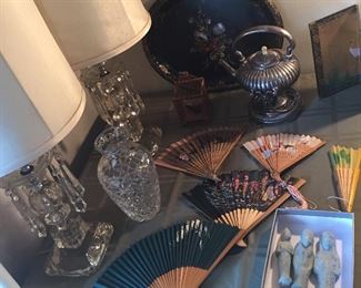 Pair of glass lamps with crystals, vintage fans, antique tin tray with mother of pearl inlay, silverplate teapot on stand