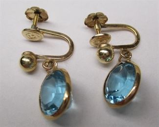 gold earrings with blue topaz