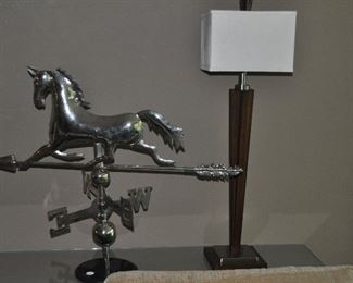 Fantastic silver stainless weather-vane arrow and galloping horse on marble base shown, 33"w x 26"h with a contemporary wood and chrome table lamp (2 available)