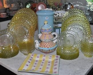 Wonderful yellow glass dinnerware sets (2 sets of 8) shown with Mackenzie Childs pottery