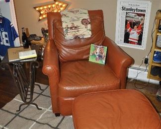 Leather chair and ottoman from Lexington Home Brand. Chair measures 34”w x 36”h x 37”d. The ottoman is 26.5”w x 15”h x 21”d
