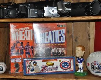 Cameras by Sony, Canon, FinePix and Vivitar zoom lenses with cases and more sport memorabilia