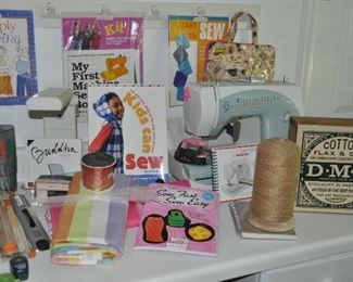 Bernette sewing machine 80e by Bernina with case and instruction book, vintage wood DMC hinged box and more books about sewing