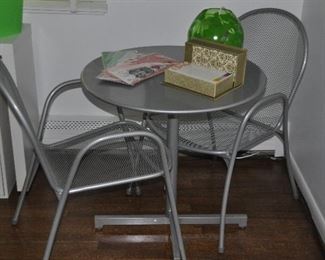Silver Aluminum 3-pc. Bistro Set. Table is a Tilt Table from Leon & Lulu, 27.5” x 28”. Chairs are from Room & Board.