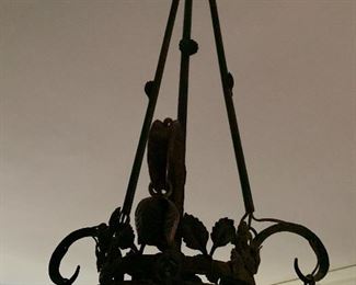 Scroll iron and glass Art Deco hanging light fixture.