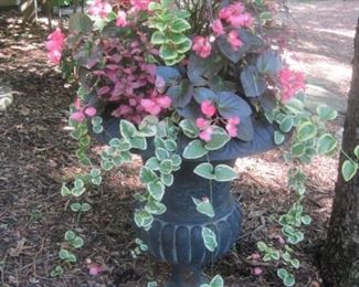 A pair of Cast Iron Urns. 