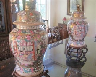 A large pair of Chinese Temple Jars with Foo Dog Lids.