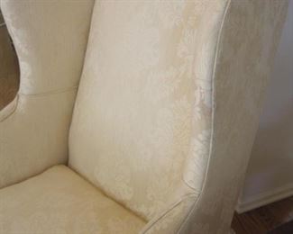 A pair of Baker Wing Back Armchairs upholstered in Damask with Ball  & Claw Feet and Down filled Cushions.