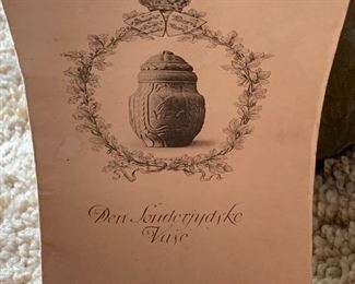 Danish urn with cover. Den Sonderjydske Vase made by Ove Jorgensen. The words say, “Don’t give up, One morning the sun will raise to freedom!”