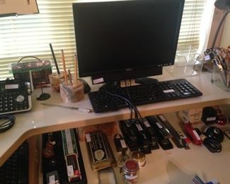 Two-tier desk and office supplies; computer monitor