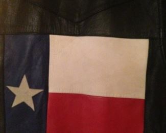 One motorcycle vest has a Texas flag on the back.