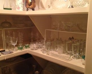 Many glasses, bowls, and other serving pieces