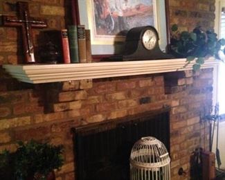Mantel clock; bird cage; picnic basket