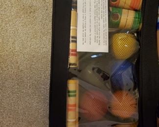 NIB Lawn Golf set.  Yes, I know that is not the right name, but I have had a glass of wine so I can't think of what this is actually called.  The wine is 14 hands.  If you haven't had any, pick up a bottle.  Good stuff