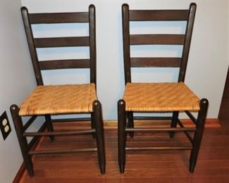 2 of 6 ladder back chairs w/ woven seats that go w/ drop leaf table