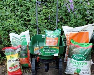 Scott's Turf Builder Edgeguard Mini Spreader; looks new.  Includes bags of Weed Control, Fertilizers, Grass Seed