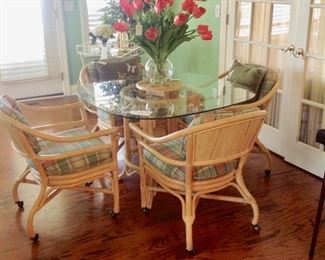 Rattan & Glass Table w/4 Rolling Chairs in great condition