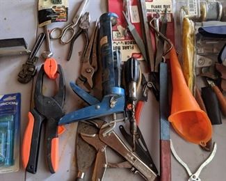 Tools, tools, tools.  Vice grips, funnels, stud finder, screwdrivers of all sizes, hand tools, car tools, files