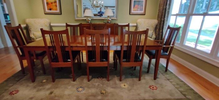 Stickley metropolitan dining room table chairs and sideboard. All pieces in fantastic condition. Cherry wood.  H- 30" W-42" L-100 includes two leaves 
