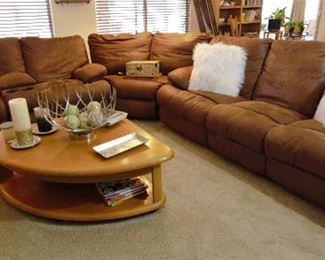 Wonderful leather sofa and unusual triangle shaped coffee table that lifts to eat on or play games or use your laptop on as a workstation.