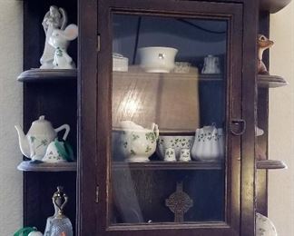 Vintage wall hanging curio cabinet.