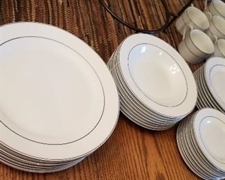 White rimmed in silver dishes. Perfect dinner set to pair with any color accessories.