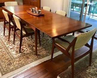 MCM teak dining table designed by Finn Juhl manufactured by France and Sons and (6) Arne Vodder for Vamo Sonderborg dining chairs with swivel backs