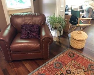 Leather chair, pottery barn rug (8 x 10), plant and plant stand and basket with lid