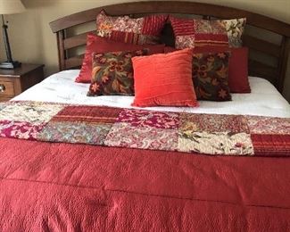 King bed with duvet and coverlets, and pillows 