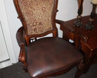Elegant wood arm chair with upholstered back and leather seat $200