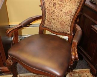 Elegant wood arm chair with upholstered back and leather seat $200