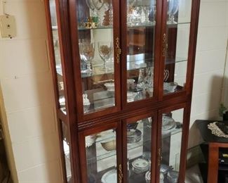 Gorgeous curio cabinet filled with dishes from Romania