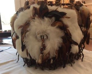 Native American basket with rabbit fur and feathers