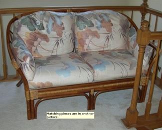 Rattan/bamboo loveseat. More matching pieces