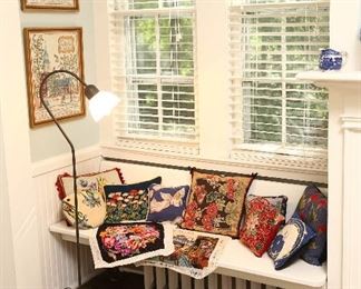 Collection of needlepoint pillows.