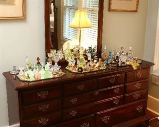 American Drew dresser and mirror, showing a large collection of vintage perfume bottles.