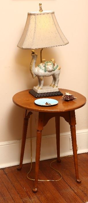 Delightful small round splay-leg table with camel lamp.