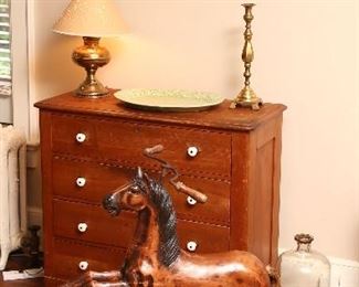 Pine cottage chest and vintage toy pedal horse.