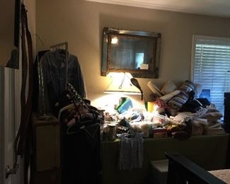 Looking into the Master Bedroom and in here you will find clothing, sewing, upholstering fabric etc.