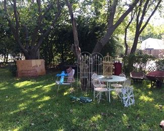 More of the back yard, vintage garden furniture, lots of accent pieces, great yard art